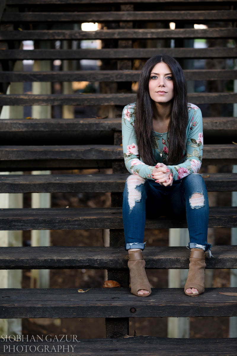 Seated personal branding portrait on outdoor stairs at Balboa Park san diego personal branding photography by Siobhan Gazur Photography