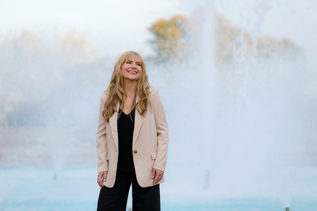 Woman standing near fountain outdoor san diego branding photography by Siobhan Gazur Photography