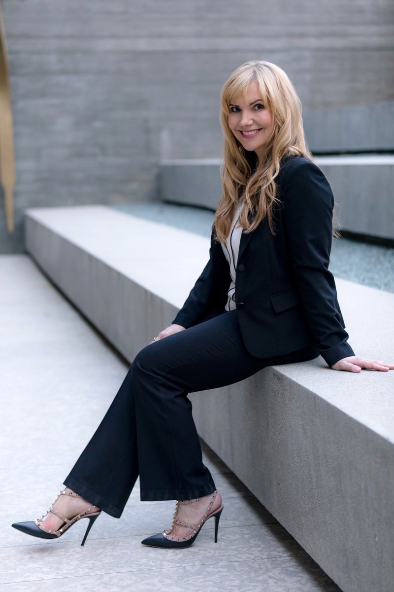 Professional businesswoman in dark suit architectural setting san diego branding photography by Siobhan Gazur Photography