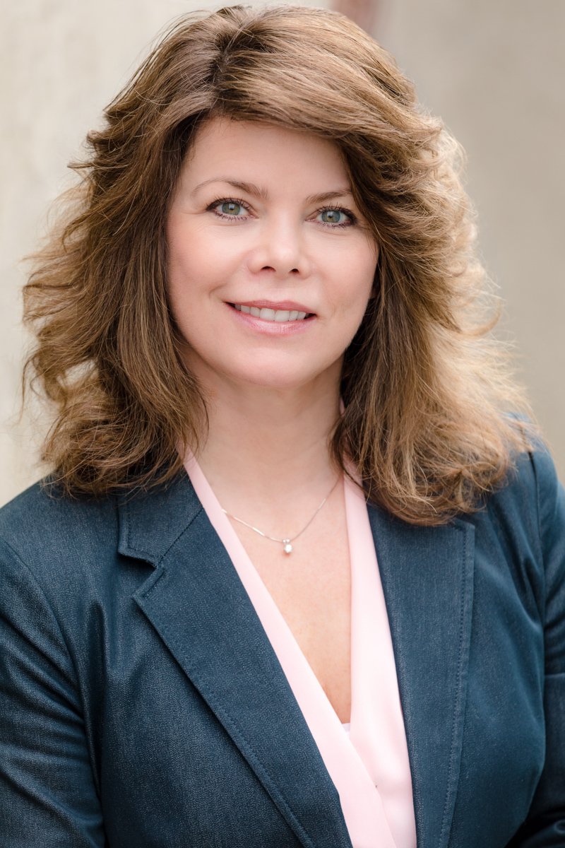 Business woman with in dark blazer on-location san diego executive headshots by Siobhan Gazur Photography
