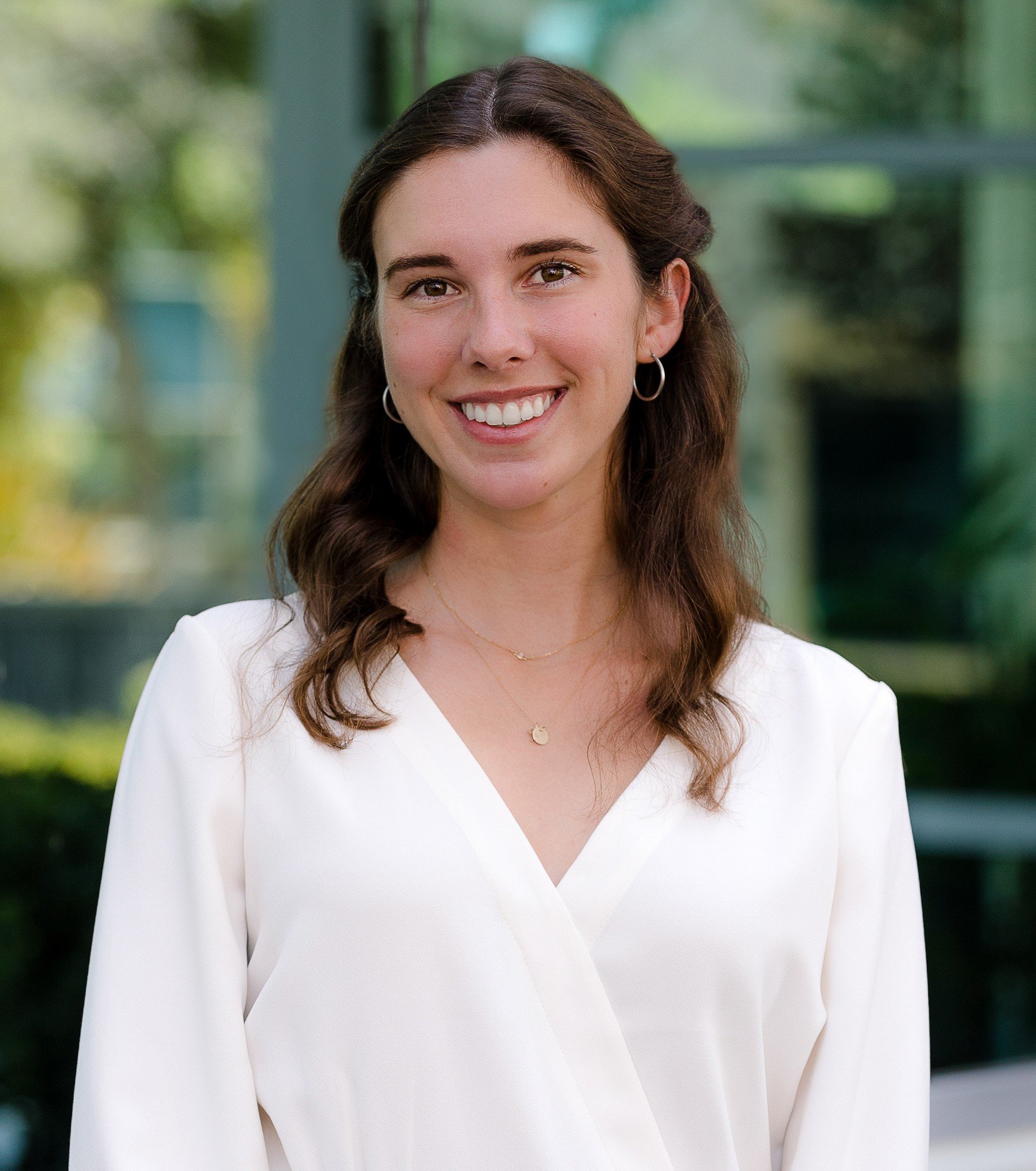 Professional woman in white blouse on location san diego professional headshots by Siobhan Gazur Photography
