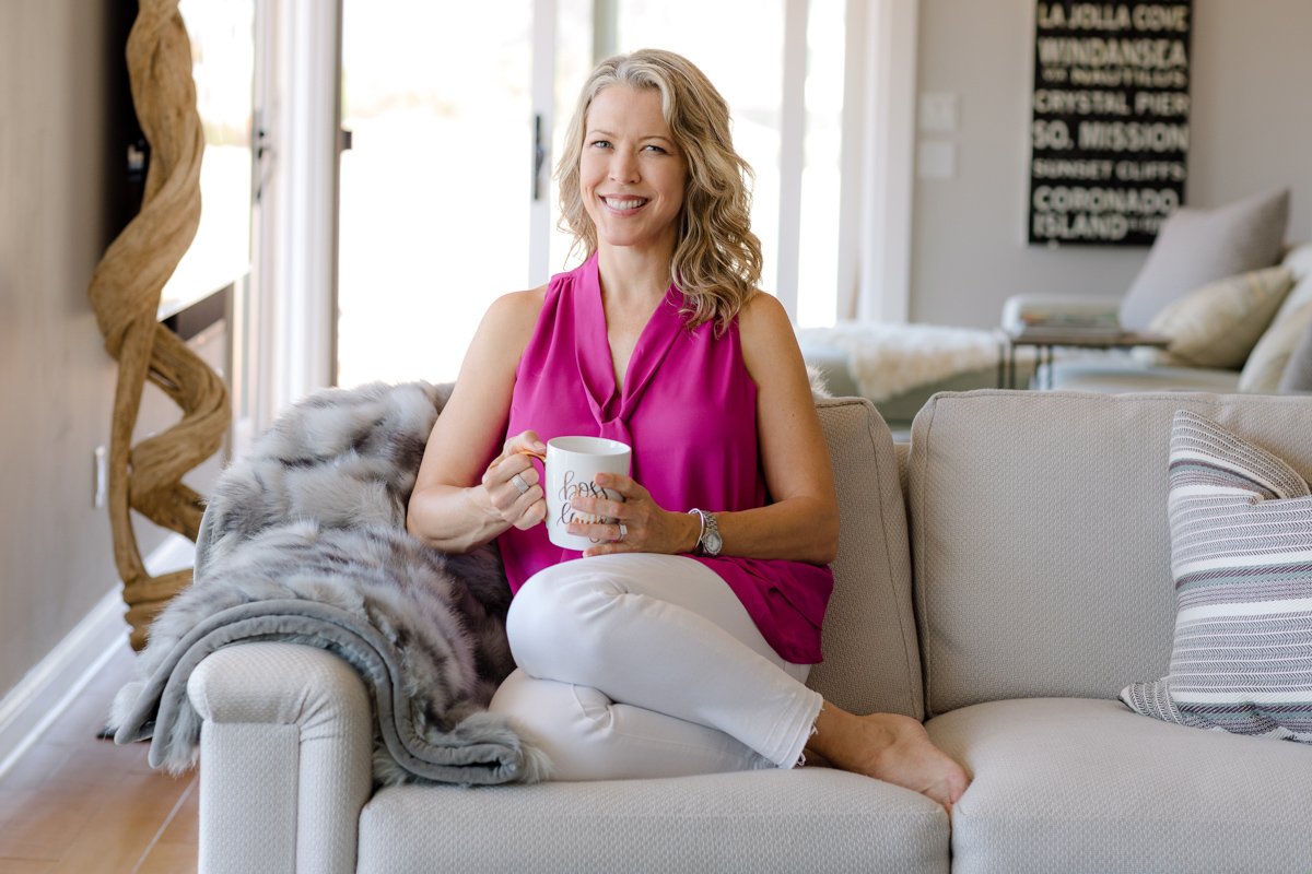 Lifestyle branding portrait of a certified educator and coach seated on a sofa with coffee personal branding photography san diego by Siobhan Gazur Photography