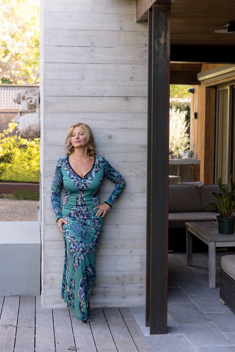 Full-body personal branding portrait of a woman near modern architecture san diego branding photography by Siobhan Gazur Photography